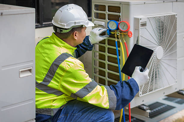 Professional Heat Pump Repair technician working in Washington, IN